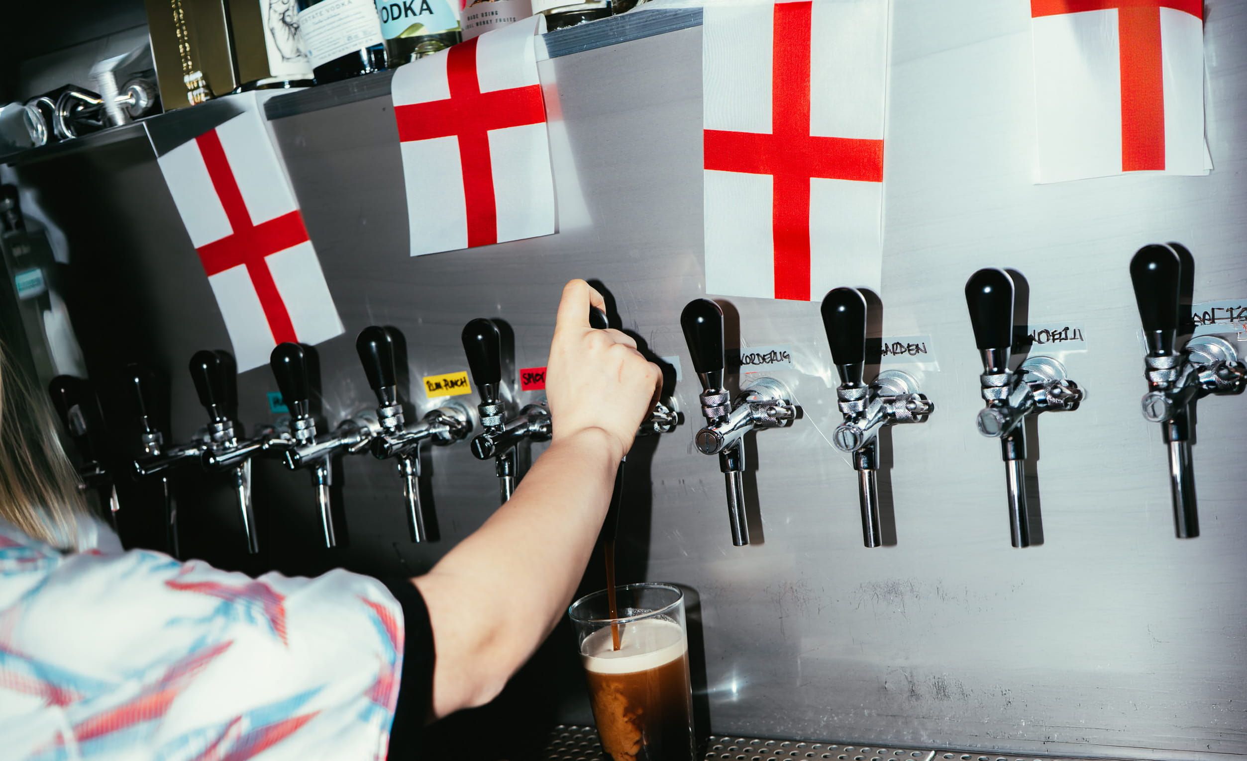 The beer taps at Trickle with England flags.